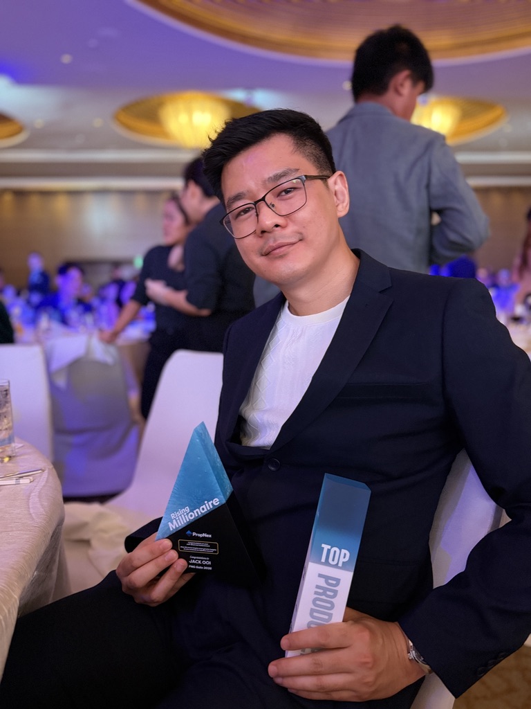 Jack Ooi with his Rising Millionaire and Top Producer awards at the PropNex PNG Gala 2026
